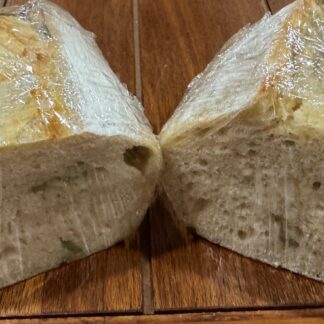 Fresh homemade Castelvetrano olives and parmesan cheese sourdough bread.